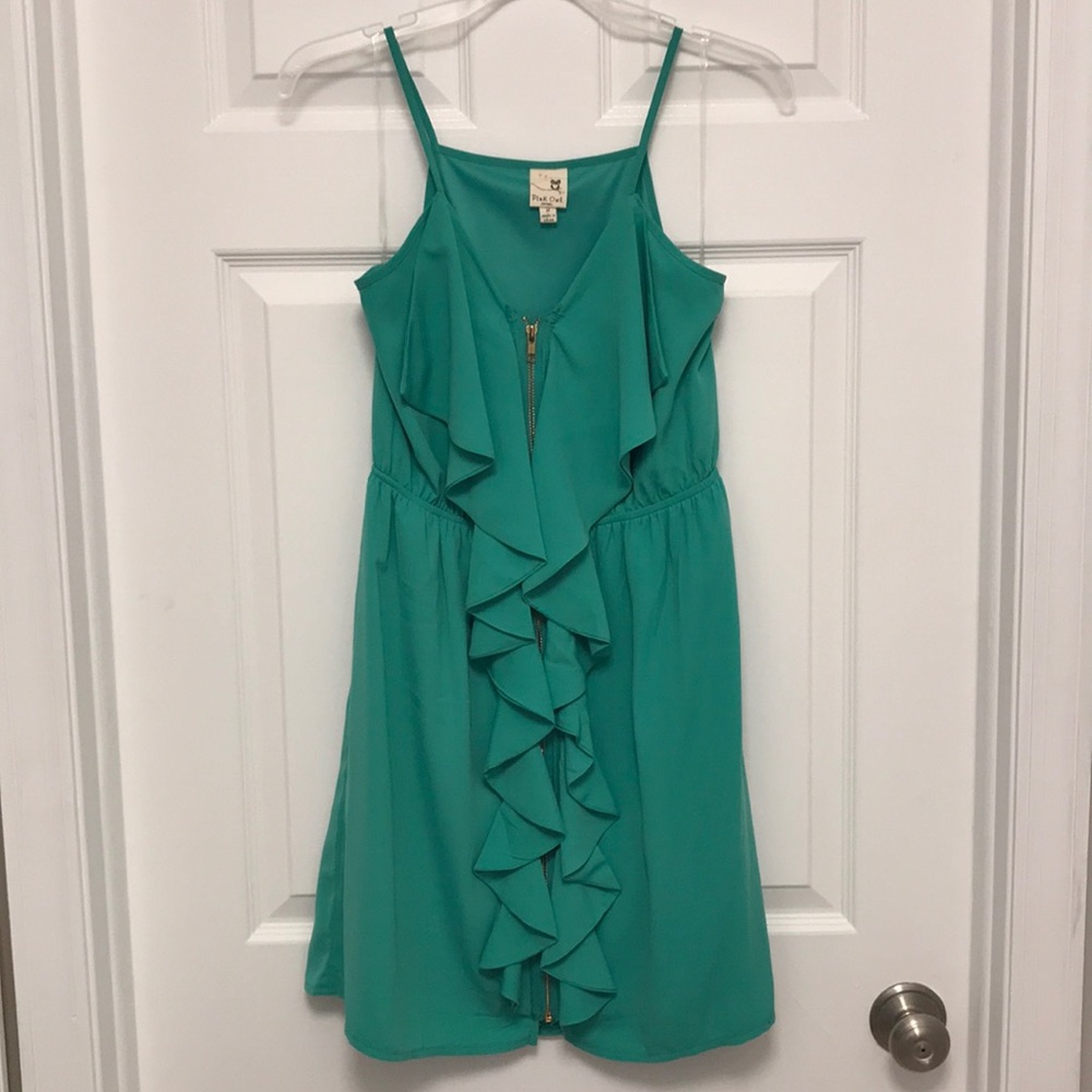 Green cocktail dress with front ruffle detail